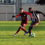 1.UNE